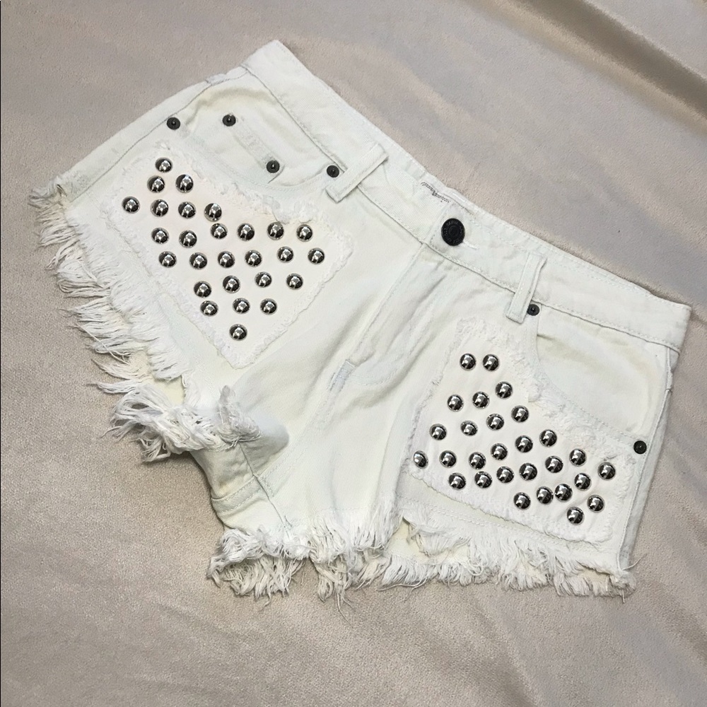 Studded distressed white jean shorts